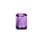 A stunning 14x10mm emerald cut dark purple amethyst gemstone on a white background, featuring a rich, natural vibrant royal purple hue. This beautifully-faceted amethyst pear, also known as the February birthstone, is ideal  for bespoke jewellery design, or as a gift to those with a February birthday.