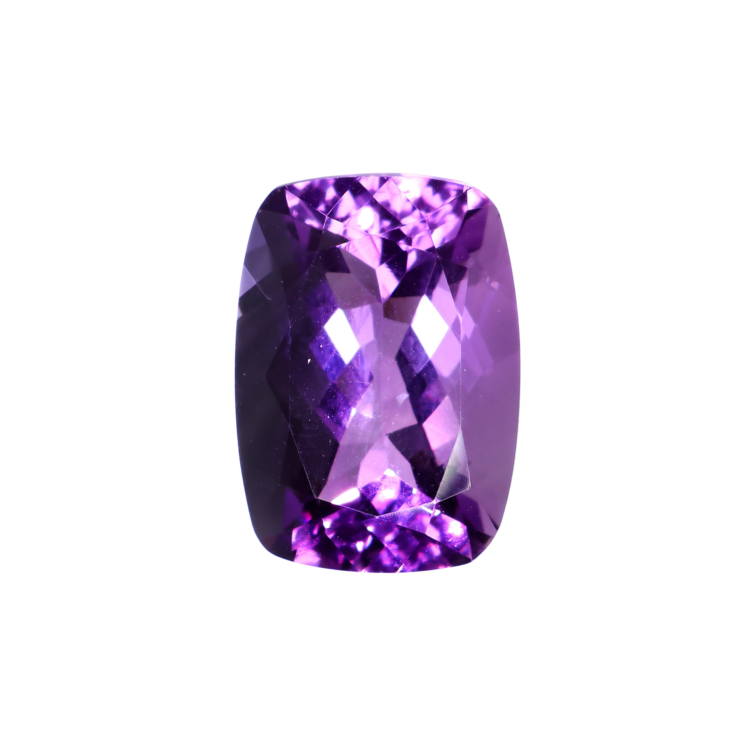 A loose 18x13mm cushion-cut amethyst gemstone sitting on a white background. The stone is elaborately faceted, showing off the amethyst's rich colouring and fire throughout. The stone would be perfect for use in a bespoke custom-designed ring, or as a February birthstone pendant gift.