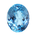 A stunning 23 x 18.5 x 14.3mm oval cut Swiss blue topaz gemstone on a white background, featuring a rich, natural saturated blue hue. This beautifully-faceted blue topaz oval, also known as the November birthstone, is ideal  for bespoke jewellery design, or as a gift to those with a November birthday.
