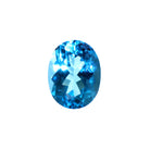A stunning 13x10mm Oval cut Swiss blue topaz gemstone on a white background, featuring a rich, natural saturated blue hue. This beautifully-faceted blue topaz oval, also known as the November birthstone, is ideal  for bespoke jewellery design, or as a gift to those with a November birthday.