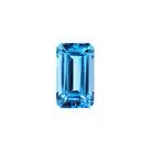 A loose 12x7mm elongated emerald Swiss blue topaz gemstone on a white background. This brilliant, saturated blue topaz, November's birthstone, is perfect for creating custom fine jewellery: including engagement rings, cocktail rings, or a striking birthstone pendant for a loved one born in November. The size is large, but small enough for use in everyday wearable jewellery - and is not limited to statement designs.