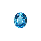 A stunning 11x9mm Oval cut Swiss blue topaz gemstone on a white background, featuring a rich, natural saturated blue hue. This beautifully-faceted blue topaz oval, also known as the November birthstone, is ideal  for bespoke jewellery design, or as a gift to those with a November birthday.