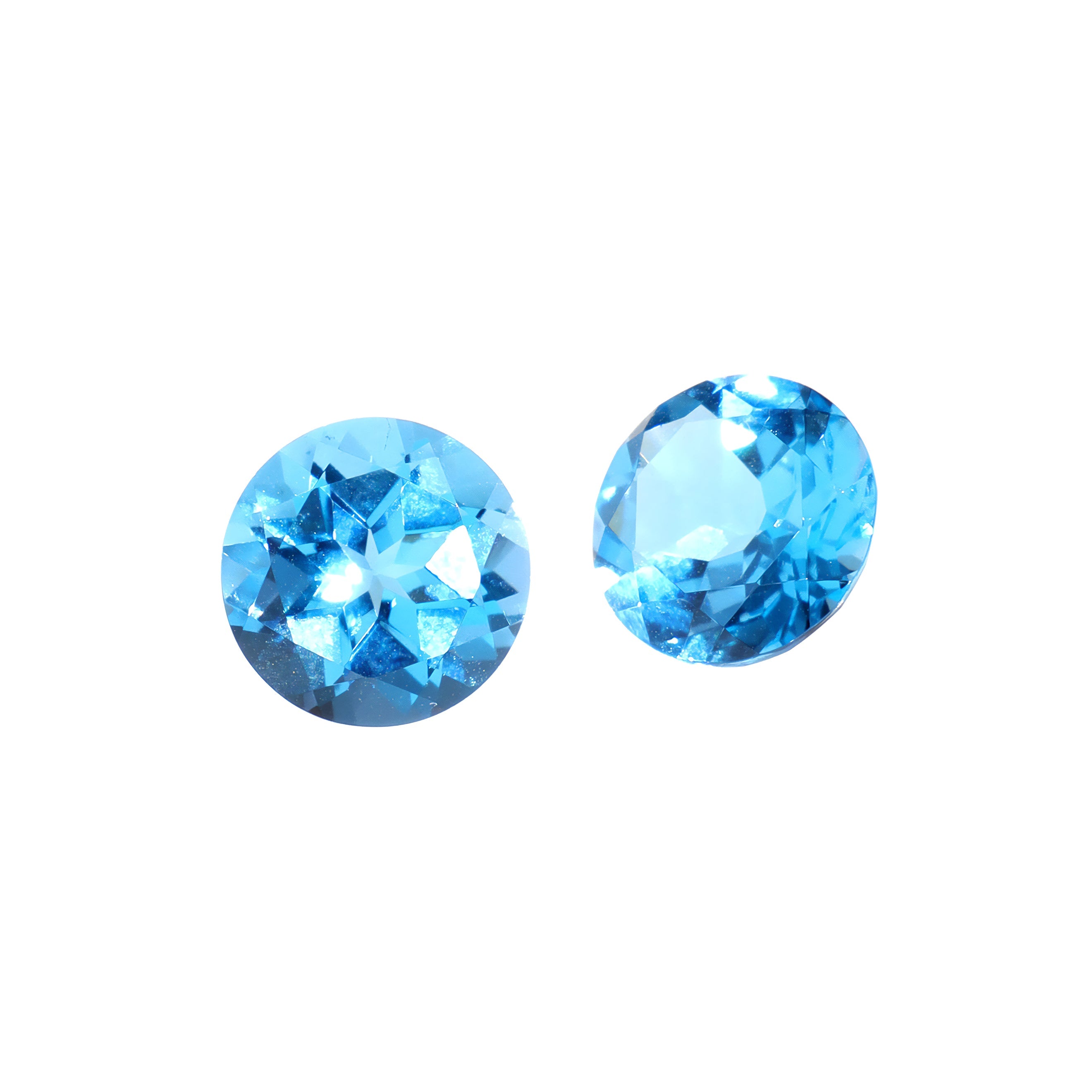 A pair of 8mm round Swiss blue topaz gemstones on a white background. The stones are perfectly-matched in both size and vibrant blue hue, and are ideal for use in a bespoke pair of birthstone earrings, or as a gift to two people with a November birthday.