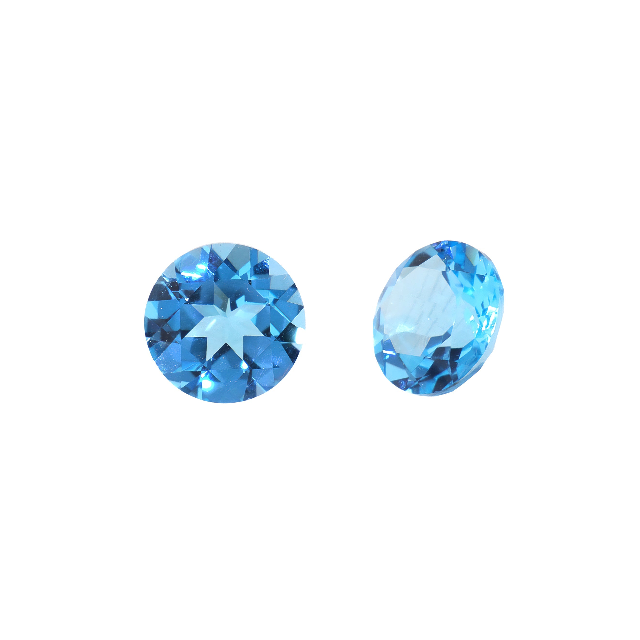 A pair of 7mm round Swiss blue topaz gemstones on a white background. The stones are perfectly-matched in both size and vibrant blue hue, and are ideal for use in a bespoke pair of birthstone earrings, or as a gift to two people with a November birthday.