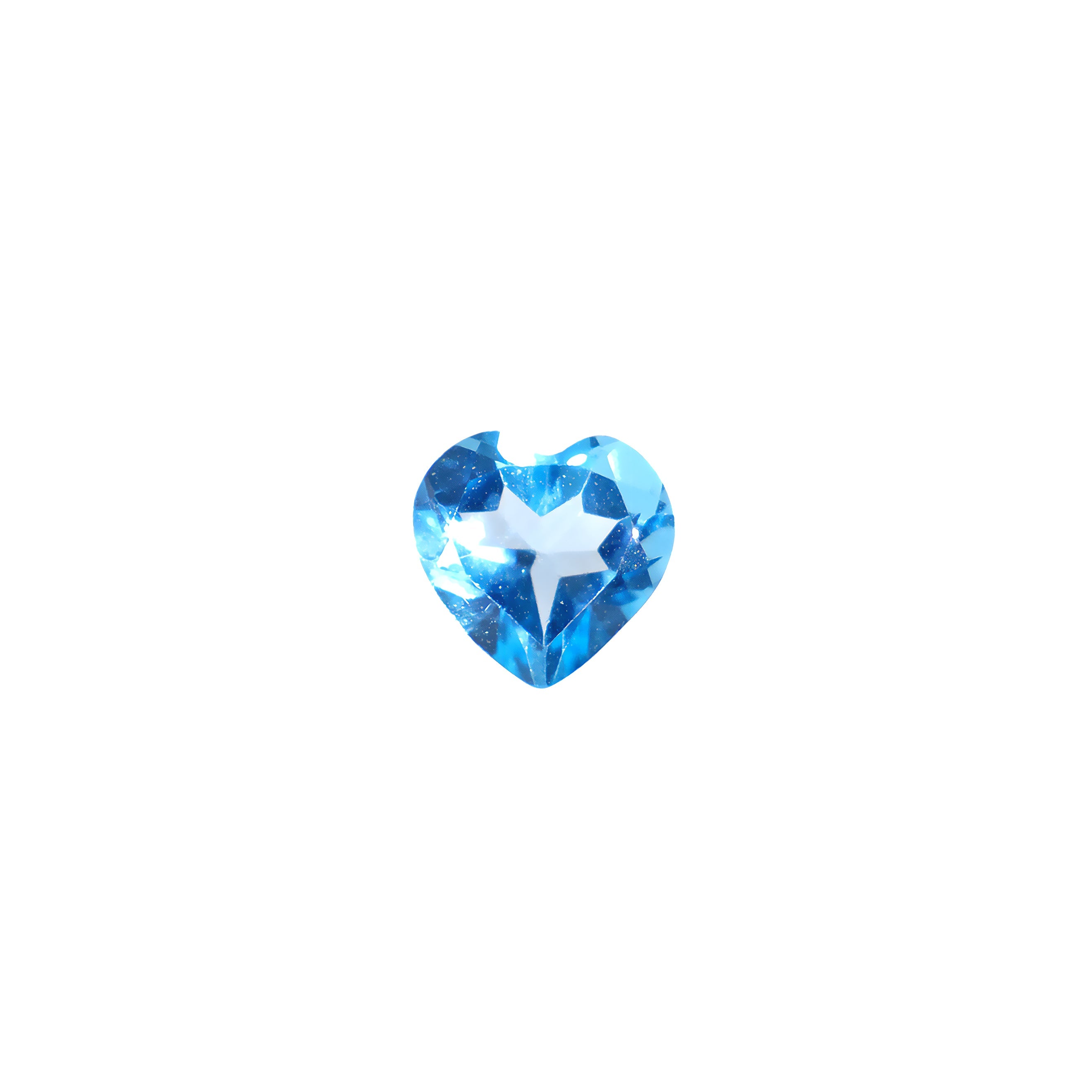 A delicate heart-shaped topaz birthstone sitting on a white background. The stone is dainty and elaborately cut into the shape of an iconic heart, and would be perfect for use in a Valentines Day or anniversary gift pendant for a loved one born in November.