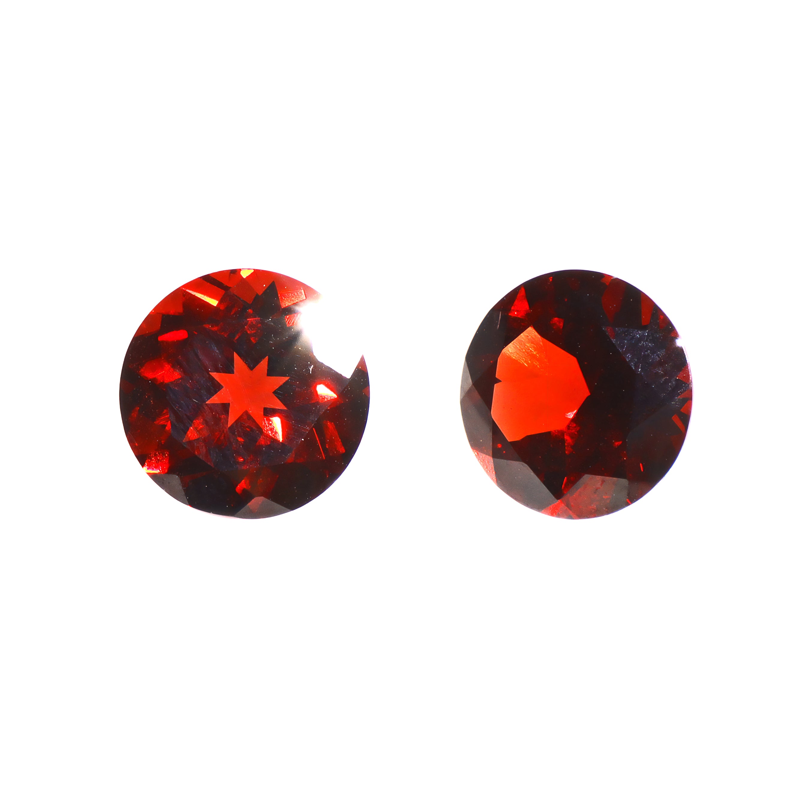 A pair of 9mm round deep red garnet gemstones on a white background. The stones are perfectly-matched in both size and rich scarlet hue, and are ideal for use in a bespoke pair of birthstone earrings, or as a gift to two people with a January birthday.