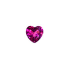 A delicate heart-shaped grape garnet gemstone sitting on a white background. The deep warm purple coloured stone is dainty and elaborately cut into the shape of an iconic heart, and would be perfect for use in a Valentines Day or anniversary gift pendant for a loved one born in January.