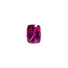 A loose 8x6mm rectangular / elongated cushion-cut grape garnet gemstone on a white background. This brilliant, richly coloured grape garnet, a variant of January's birthstone, is perfect for creating custom fine jewellery: including engagement rings, cocktail rings, or a striking birthstone pendant for a loved one born in January. The size is large, but small enough for use in everyday wearable jewellery - and is not limited to statement designs.