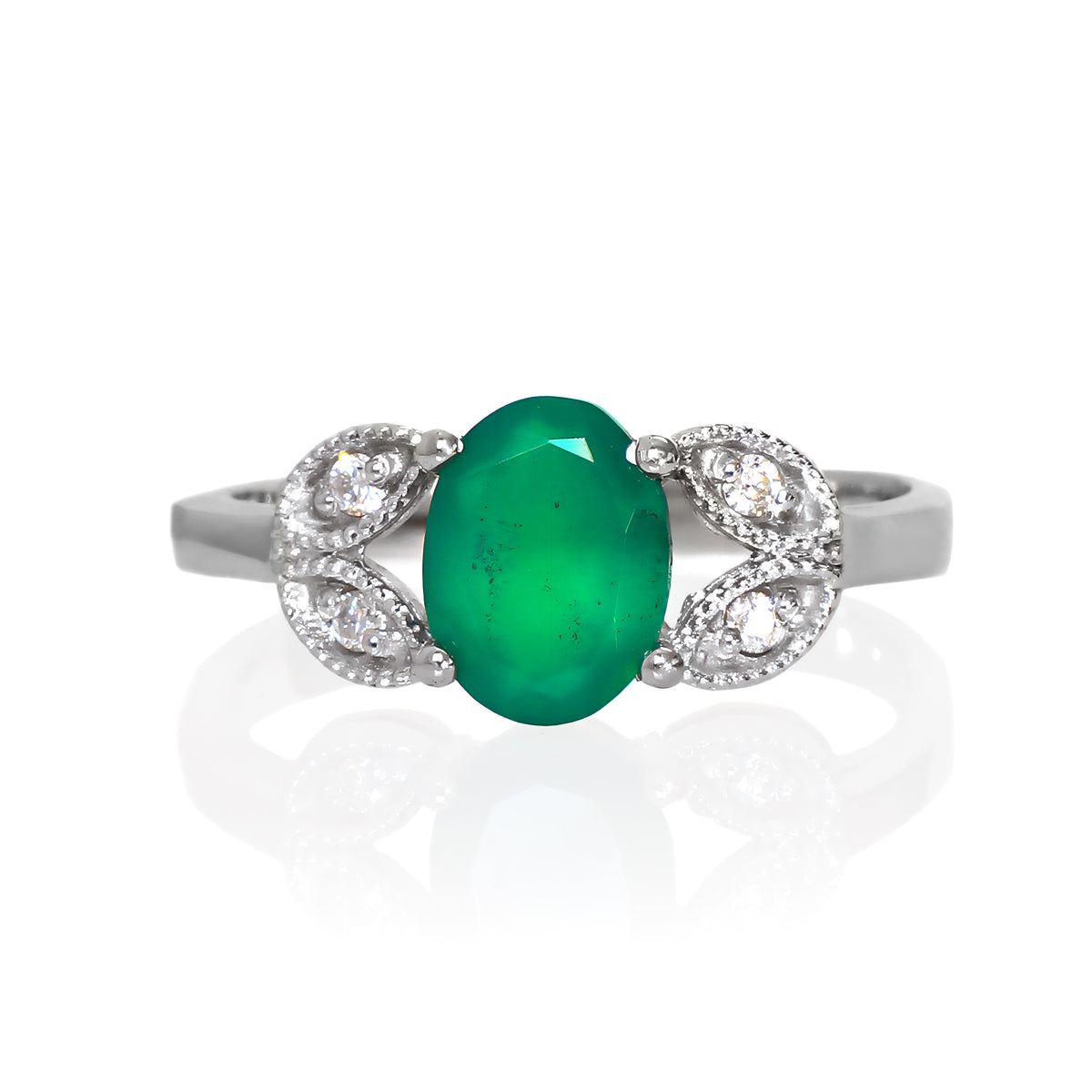 A product photo of an oval green onyx and moissanite ring with floral silver detailing set in solid 925 sterling silver metal. The bold 8x6mm green onyx gemstone is held in place by two petal shapes in filigree silver detailing on either side, each "petal" adorned with a single moissanite in the centre, to a total of 4.