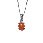A product photo of a orange cabochon moonstone set in solid sterling silver suspended by a silver chain over a white background. The smooth cabochon moonstone is framed by flowery sterling silver detailing.