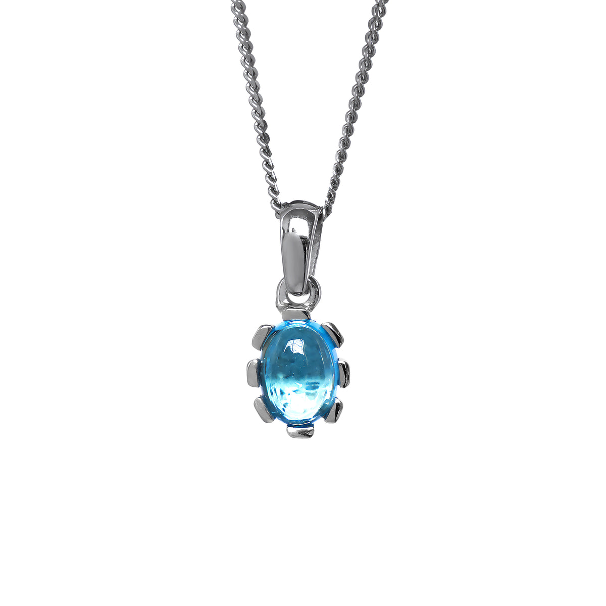 A product photo of a cabochon purple blue topaz set in solid sterling silver suspended by a silver chain over a white background. The smooth cabochon blue topaz is framed by flowery sterling silver detailing.