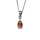 A product photo of a sterling silver copper rutile and moissanite necklace sitting against a white background. The beautifully unique copper rutile stone is held in place by 4 pairs of claws at its top and bottom, with a single white moissanites connecting the stone to the rest of the pendant. It is suspended by a simple sterling silver chain.