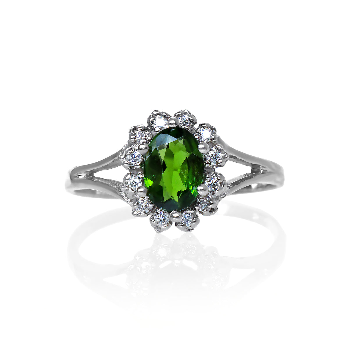 A product photo of a lavish floral moissanite halo chrome diopside ring in solid silver on a white background. The smooth band splits in two halfway along its length on either side, meeting the floral halo and chrome diopside in the centre. The chrome diopside centre stone is held in place by 4 claws.
