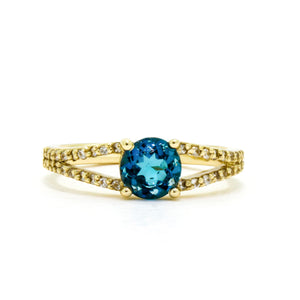 
            
                Load image into Gallery viewer, An ornate golden ring with a dazzlling centre topaz and diamond band detailing.
            
        