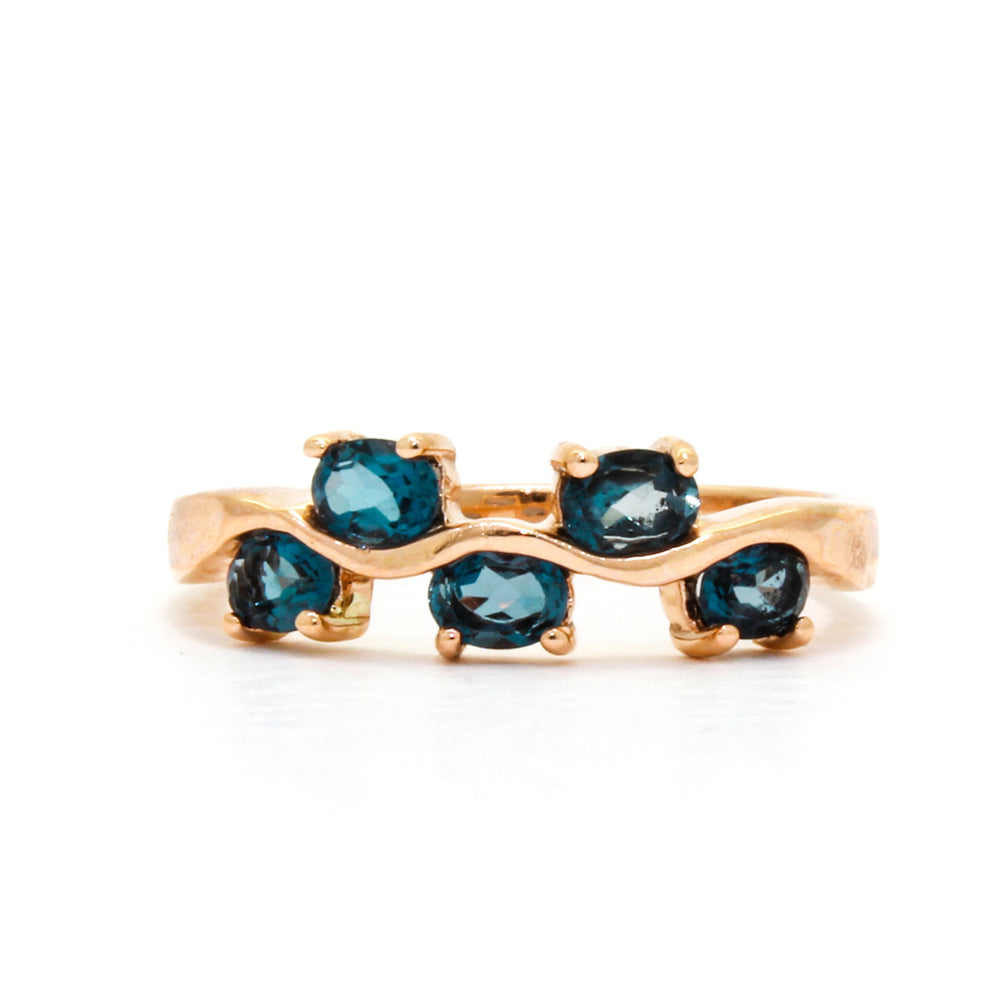 
            
                Load image into Gallery viewer, An elaborate rose gold ring decorated with topaz.
            
        