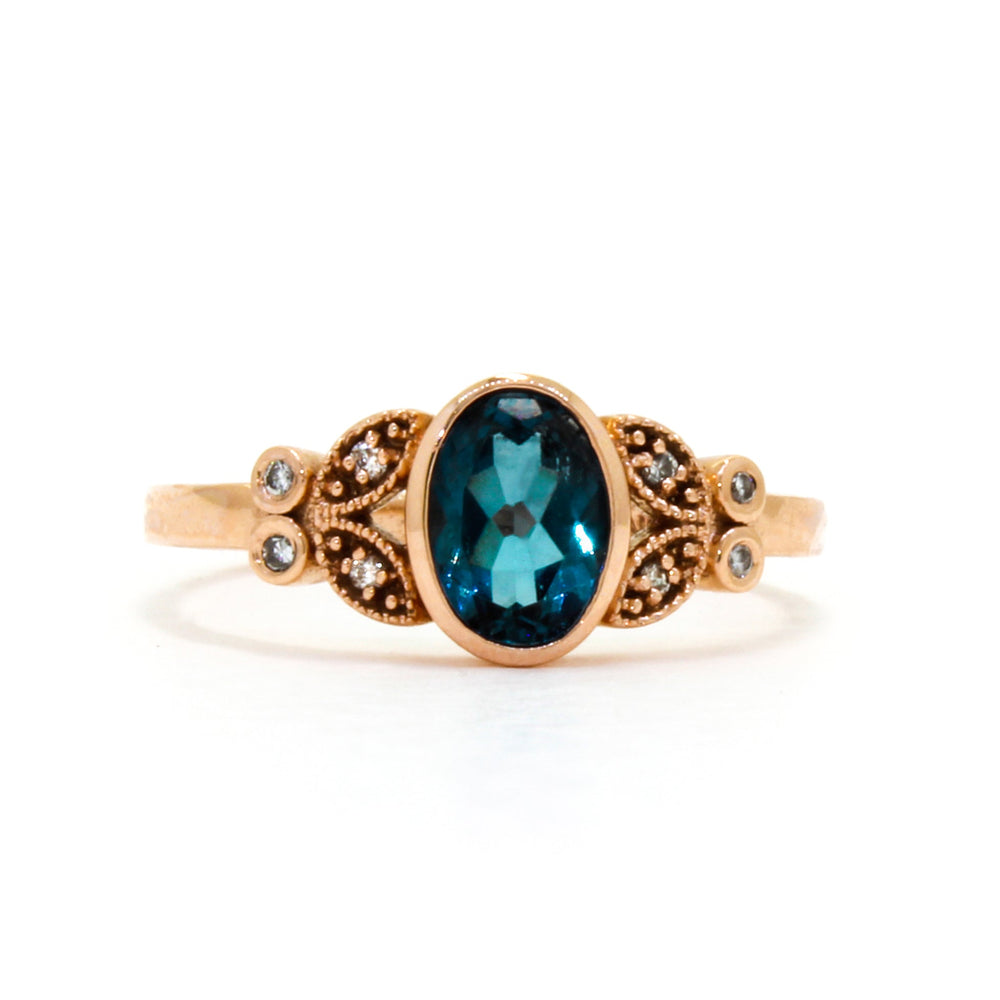 
            
                Load image into Gallery viewer, A boldy ornate statement ring with an impressive topaz centre stone and flowery diamond detailing.
            
        