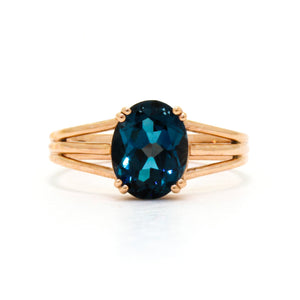 A gorgeous daedal rose gold ring with an impressive topaz centre stone.
