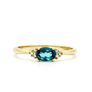 
            
                Load image into Gallery viewer, A dainty and elegant golden ring with a stunning combination of topaz and diamond detailing.
            
        