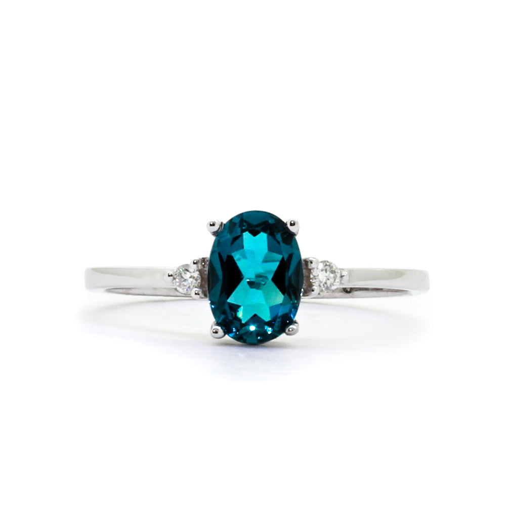 
            
                Load image into Gallery viewer, A dainty and elegant white gold ring with a stunning trio of topaz and diamonds.
            
        