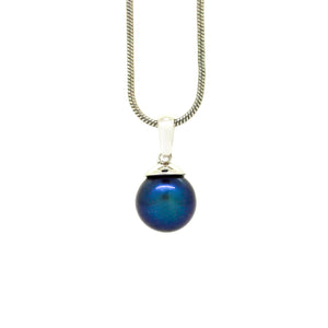 
            
                Load image into Gallery viewer, A product photo of a simple white gold pendant suspended by a white gold chain against a white background, the dark peacock pearl in stark contrast to the rest.
            
        