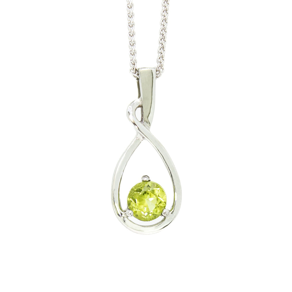 A product photo of a silver pendant with a light green peridot centre stone. The stone sits at the base of a silver teardrop shape, which curves elegantly as it flows towards the base. The pendant is suspended by a silver chain against a white background.
