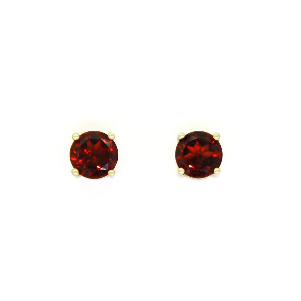 
            
                Load image into Gallery viewer, A product photo of 5.5mm Round Garnet Earring Studs in 9k Yellow Gold sitting on a plain white background. The stones are held in place by 4 delicate golden claws. The garnets reflect sanguine hues across their multi-faceted edges.
            
        