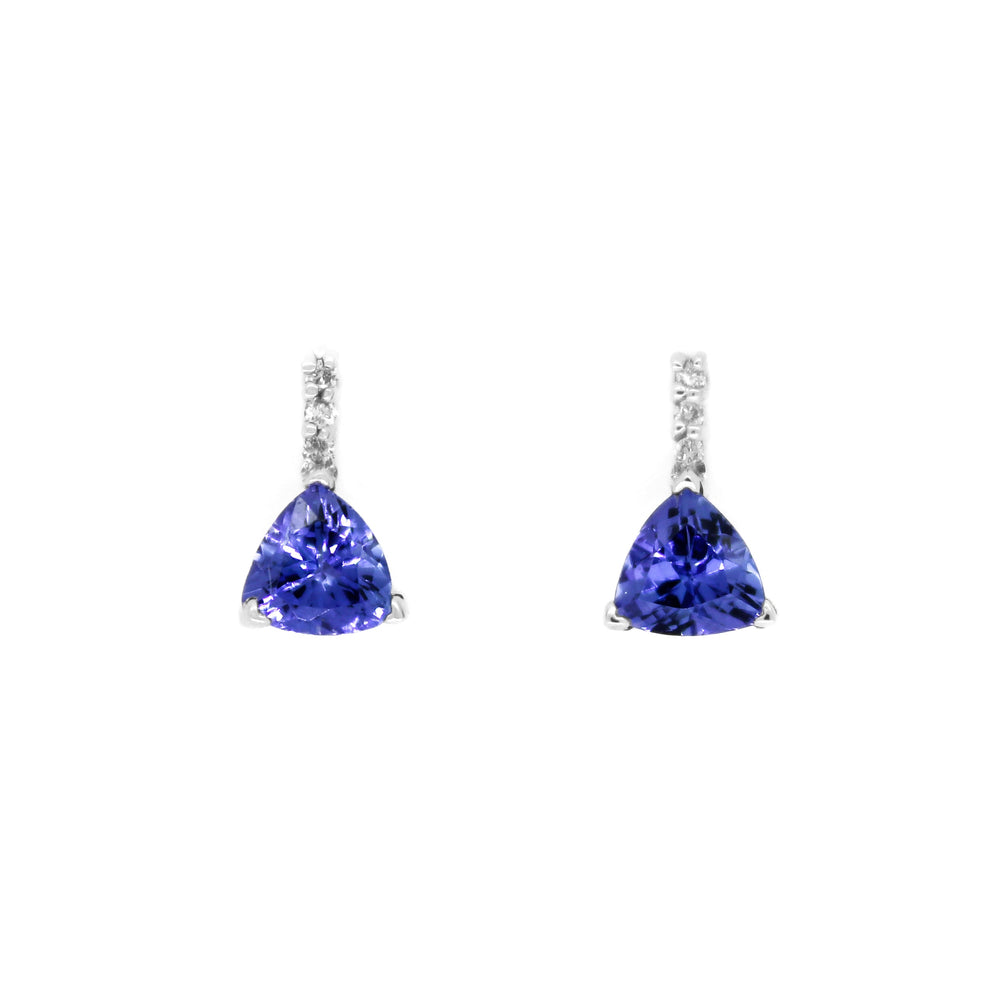 
            
                Load image into Gallery viewer, A product photo of white gold tanzanite stud earrings sitting on a white background. A golden strip connects the trilliant stones to the studs, each strip adorned with 3 diamonds each.The deep blue tanzanite stones reflect violet blue and indigo light from their many edges.
            
        