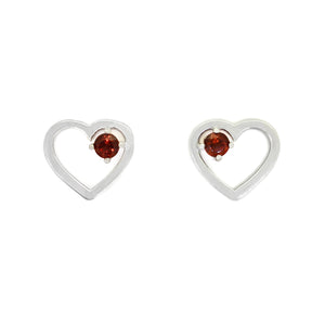 
            
                Load image into Gallery viewer, A product photo of two silver heart-shaped stud earrings sitting on a white background. A delicate, 2.5mm round red garnet is nestled in the top right corner of each heart-shaped frame.
            
        