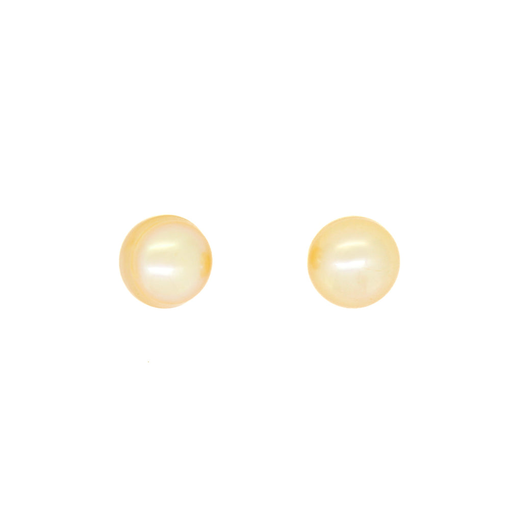 A product photo of a pair of simple golden pearl stud earrings in yellow gold sitting on a white background.