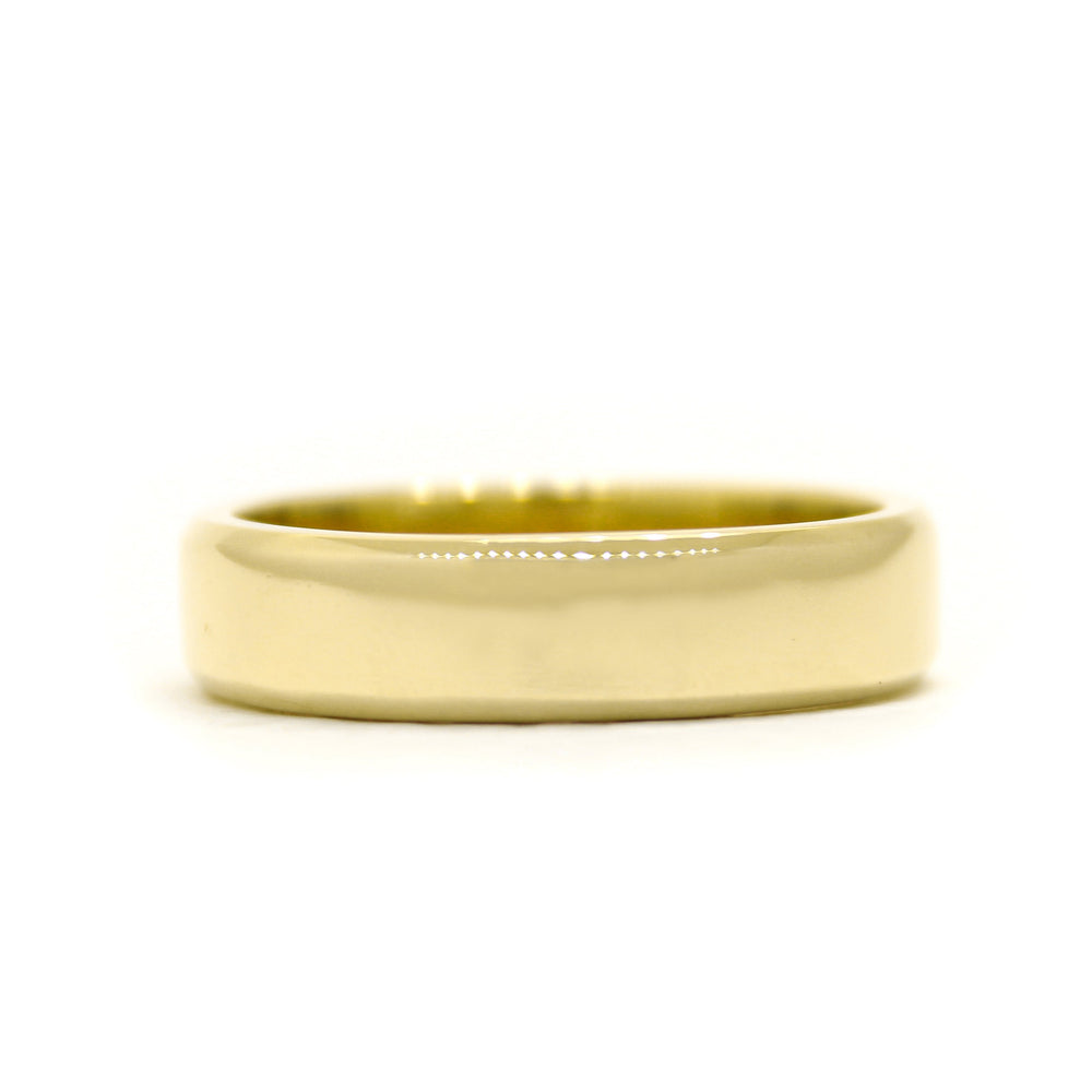 A product photo of a mens' ring made of 9k yellow gold. The band is 5mm tall and flat, and has bold squared edges.
