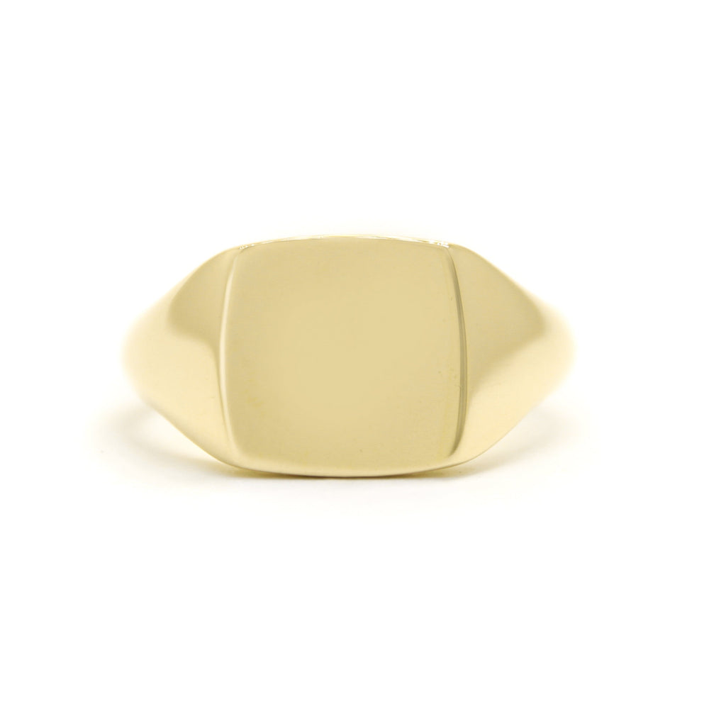 A product photo of a mens' signet ring made of 9k yellow gold. The face of the ring is a 10mm flat square that transitions to a thick rounded band.