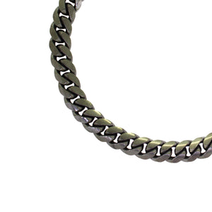 A product photo of a men's silver wrist chain on a blank white background. The chain has classic, 210 gauge ovoid-shaped curb links.