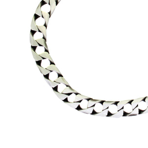 
            
                Load image into Gallery viewer, A product photo of a men&amp;#39;s silver wrist chain on a blank white background. The silver is oxidated, and the chain has bold, 250 gauge curb links making up its length.
            
        