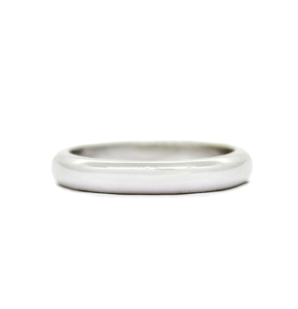 A product photo of a mens' ring made of 9k yellow gold. The band is softly rounded in a D shape.