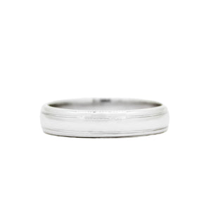 A product photo of a mens' ring made of 9k white gold. The band is 5mm tall and detailed with two polished grooves running along its length.
