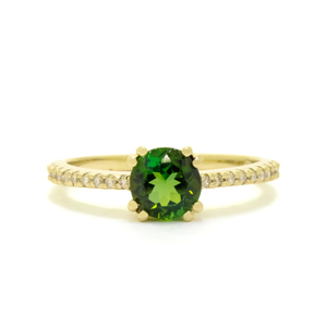 A product photo of a diamond-embedded 9k yellow gold solitaire ring with a forest-green tournaline centre stone sitting on a white background. The green gemstone colour be a good emerald substitute.