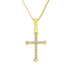 A product photo of a solid 9ct yellow gold diamond-embedded pendant in the shape of a Christian cross suspended by a golden chain against a white background. The cross is made up of 16 diamonds in total, with the ends of each limb punctuated with slightly larger diamonds.