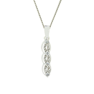 A product photo of a solid 9ct white gold and diamond pendant suspended by a golden chain against a white background. The design is centred around two golden twines bejewelled with diamonds, which curl around one another vertically to create 3 "loops". The twines are framed by additional smooth white gold bands on either side. 12 white diamonds are embeded in the twines, with 4 larger white diamonds punctuating where the twines overlap.
