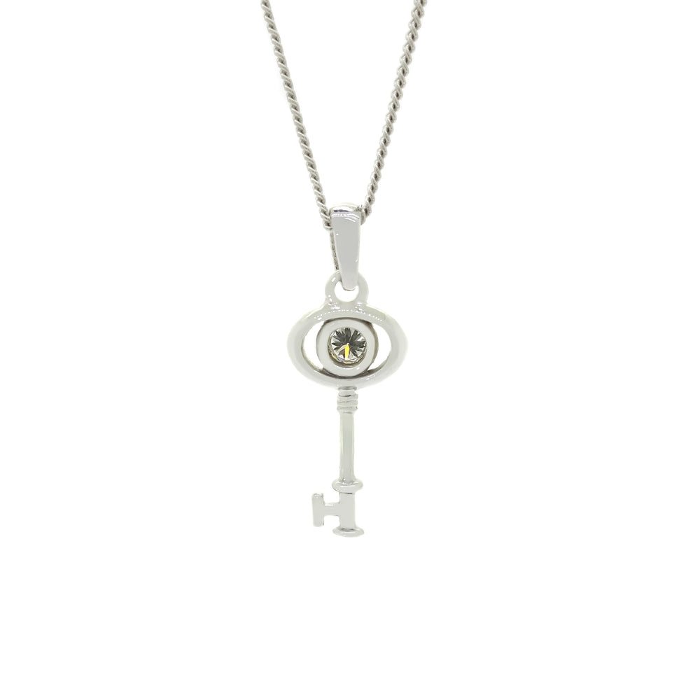
            
                Load image into Gallery viewer, A product photo of a ceremonial diamond key pendant set in solid 9ct white gold. The design is dainty and left purposefully vague, so it may serve as a traditional 21st birthday present or as a key to something special to the wearer. The design consists of smooth and simple gold, with an oval-shaped loop framing a single round bezel-set diamond as the bow of the key, almost resembling an eye, while the rest of the key&amp;#39;s design is simple and classic.
            
        