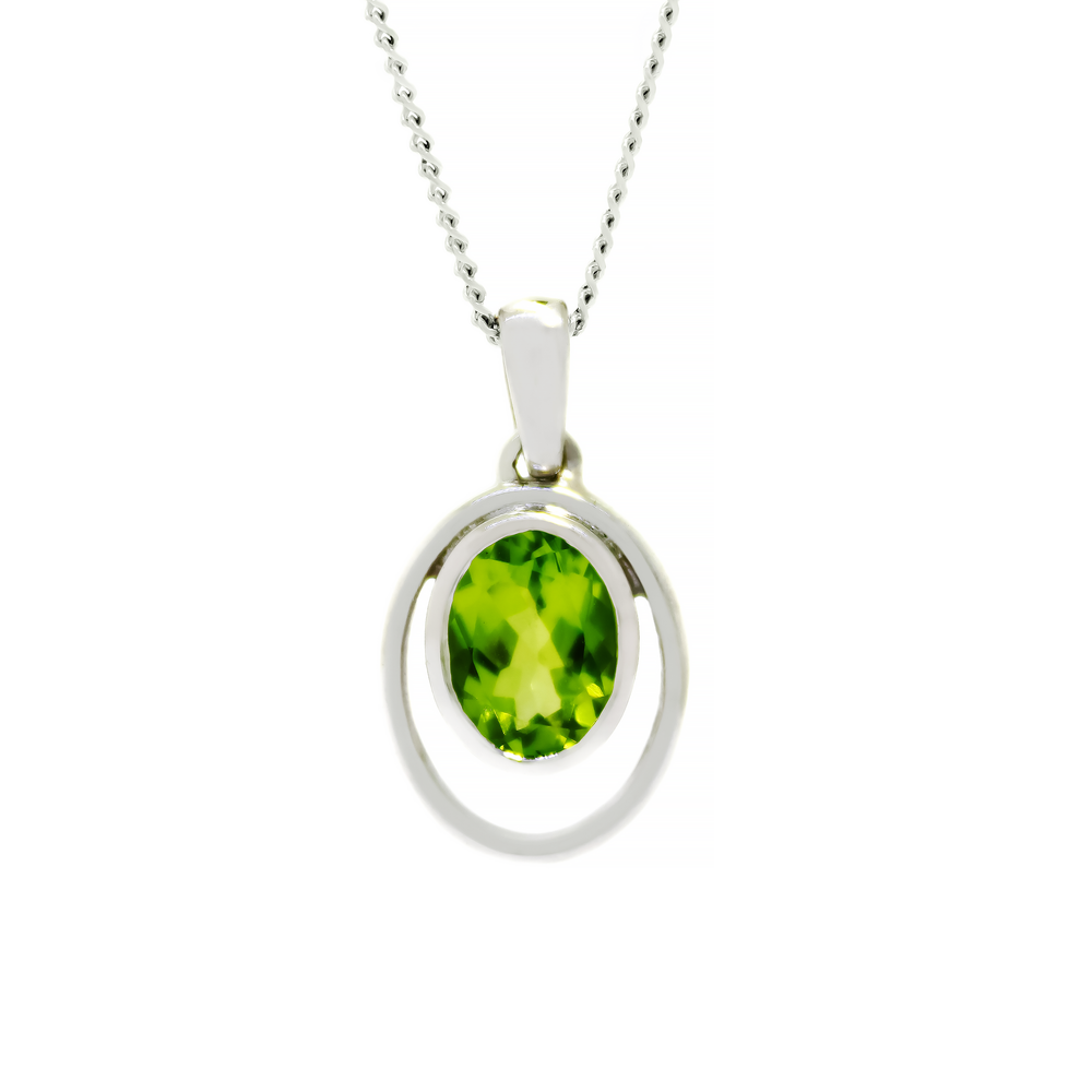 A product photo of a 5.5mm Round Bezel-set Peridot Pendant in 9ct White Gold sitting on a plain white background. The bezel-set stone is nestled at the bottom of a golden oval loop of a similar thickness to the bezel frame. The peridot reflects chartreuse hues across its multi-faceted edges.