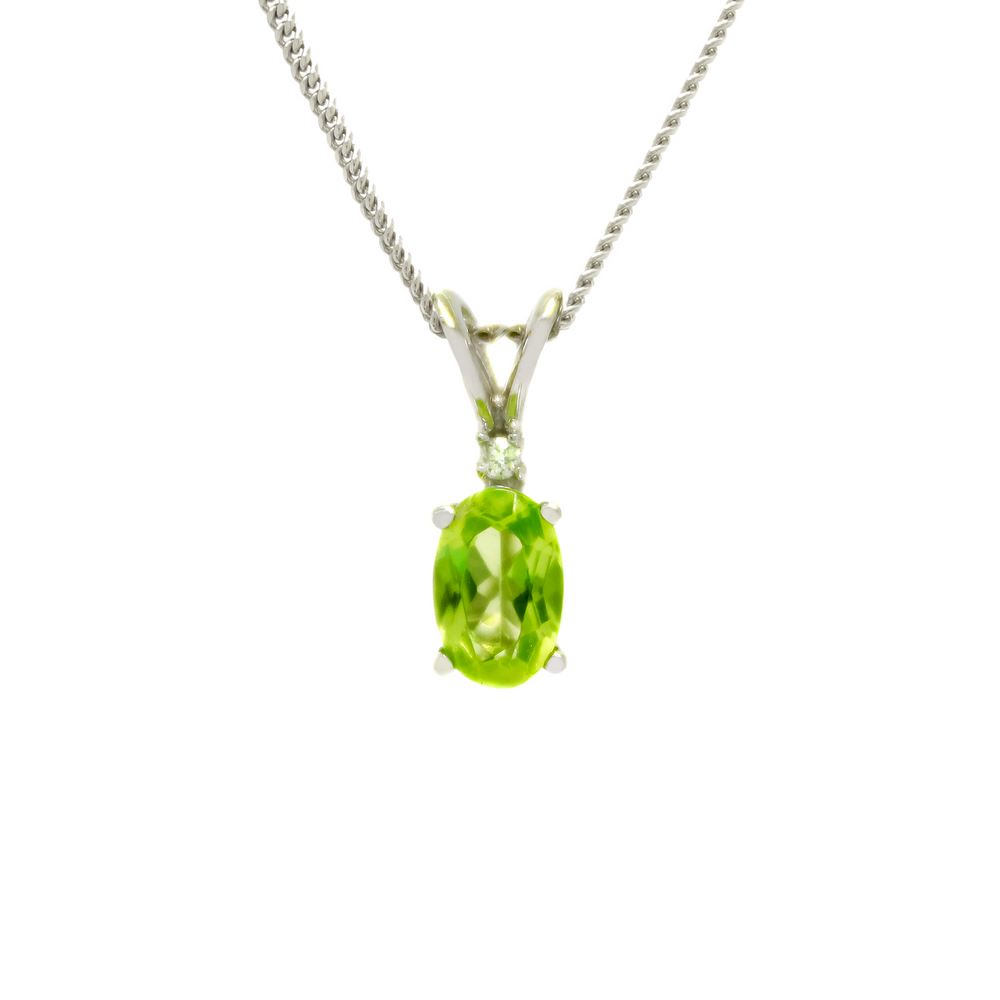 
            
                Load image into Gallery viewer, A product photo of an oval peridot and diamond pendant in 9ct white gold suspended against a white background. The oval green gemstone is a stunningly bright grass green colour. A single white diamond sits atop it, before meeting the split golden bail.
            
        