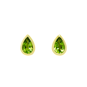 A product photo of 9ct yellow gold peridot stud earrings sitting on a white background. The pear-shaped stones are encased by thick, yellow gold frames in the shapes of teardrops. The bright green peridot stones reflect chartreuse light from their many edges.