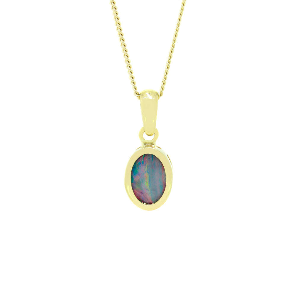 
            
                Load image into Gallery viewer, A product photo of an opal doublet pendant set in solid 9ct gold suspended by a golden chain over a white background. The opal doublet is a unique shade of blue, shimmers with multi-coloured light and is framed by a solid bezel layer of 9ct yellow gold.
            
        