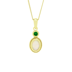 A product photo of a white opal and tsavorite pendant set in solid 9ct gold suspended by a golden chain over a white background. The white opal stone shimmers with orange and green fire, and is framed by a thick layer of yellow gold bezel and filigree detailing. Above it sits a bright green tsavorite stone, also framed in bezel.