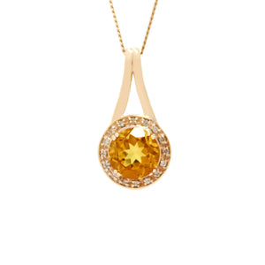 A product photo of a diamond halo citrine necklace in solid 9 karat rose gold suspended against a white background. The 8mm citrine sits surrounded by 16 diamonds at the base of the pendant, with a smooth tapering gold length serving as its connection to the bail.