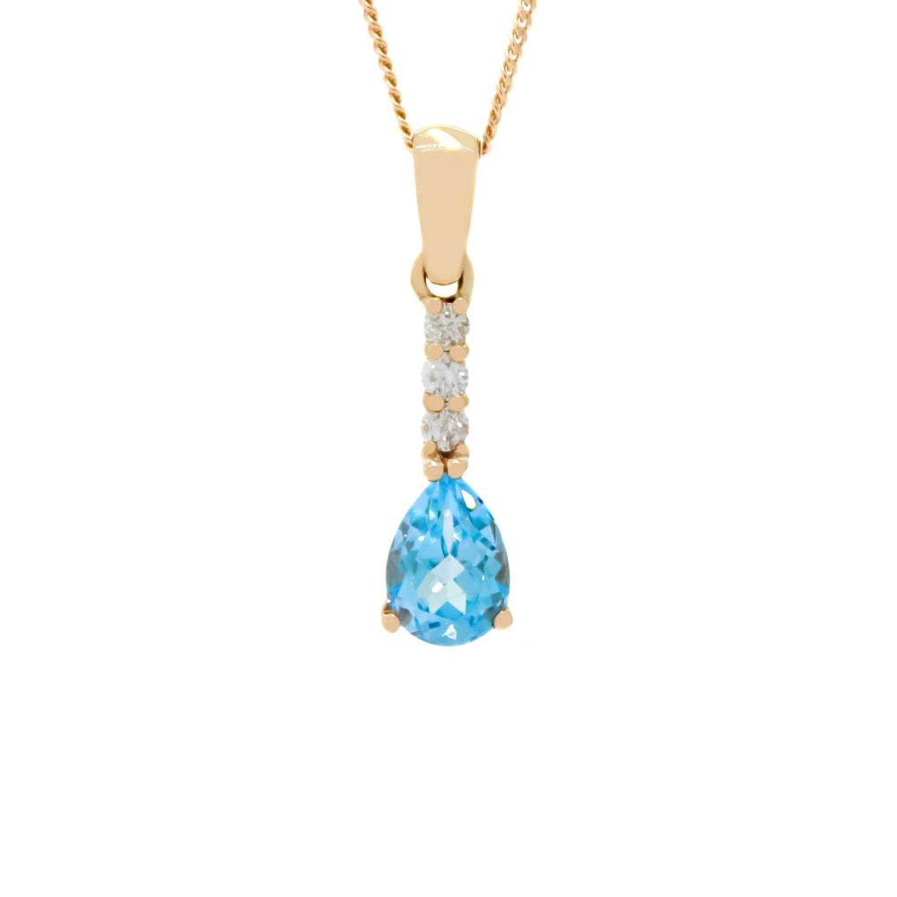 A product photo of a 7x5mm Pear blue topaz & Diamond necklace in 9k Rose Gold suspended against a white background. A golden strip connects the sky blue topaz stone to the stud, adorned with 3 diamonds. It is suspended by a simple gold chain.