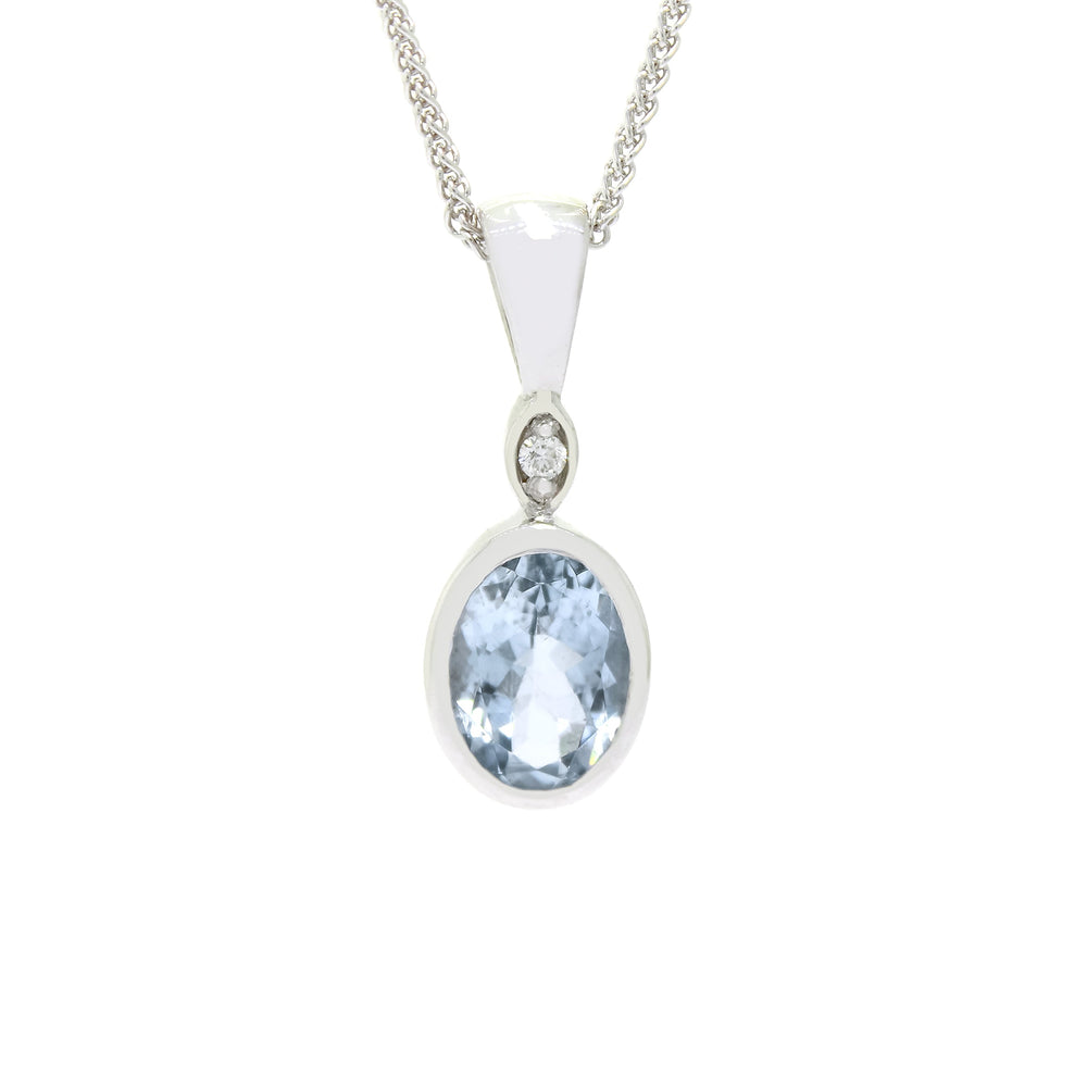 A product photo of a Bezel-set Aquamarine Pendant and diamond in 9ct White Gold suspended by a gold chain on a plain white background. Above the bezel-set aquamarine stone sits a single white diamond, also encased in white gold.