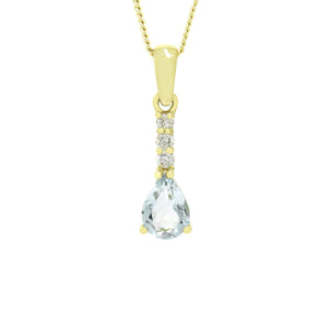 A product photo of a 7x5mm Pear Aquamarine & Diamond Pendant in 9k Yellow Gold suspended against a white background. A golden strip connects the aquamarine to the bail, adorned with 3 diamonds. It is suspended by a simple gold chain.