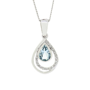 A product photo of a modern and elegant aquamarine and diamond pendant in 9k white gold. The pear-shaped bezel--set aquamarine jewel sits at the base of a teardrop-shaped frame of solid white gold, adorned with diamond details, which is echoed by a another teardrop-shaped smooth golden frame slightly offset from the centre.