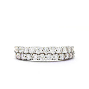 
            
                Load image into Gallery viewer, A product photo of a solid 2-tiered 9ct white gold and moissanite eternity ring sitting on a white background. The face of the ring is made up of 2 offset rows of 22 0.05ct moissanites in total.
            
        